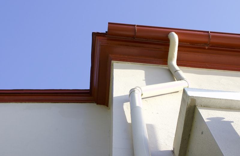 Gutter corner detail against a clear blue sky