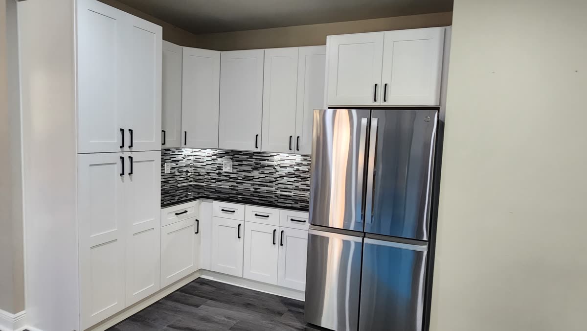 Cherry cabinetry kitchen with a granite island and bar seating